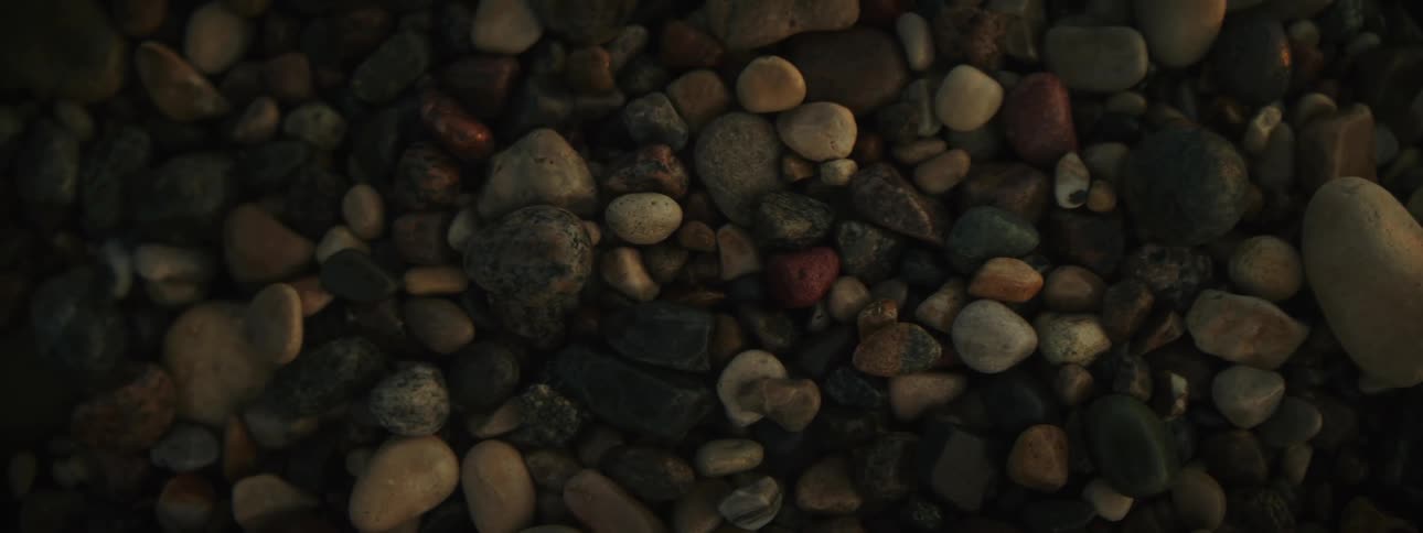 Smooth round stones on pebble beach