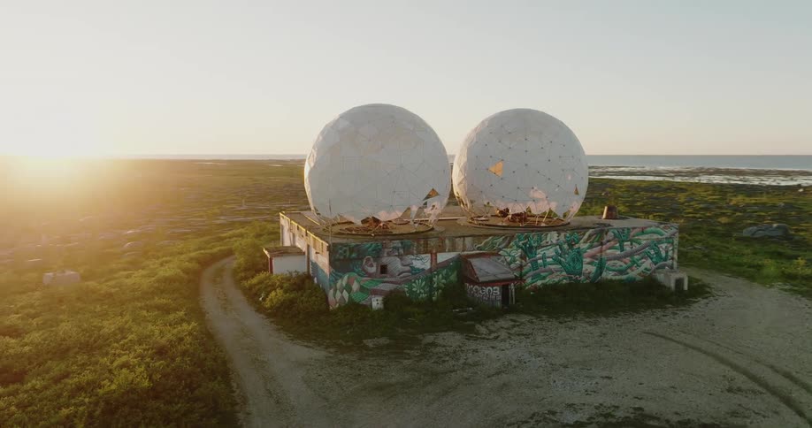 An aerial view of a building with spheres on it