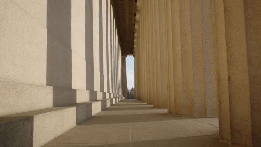 The sun shining through the acropolis' columns