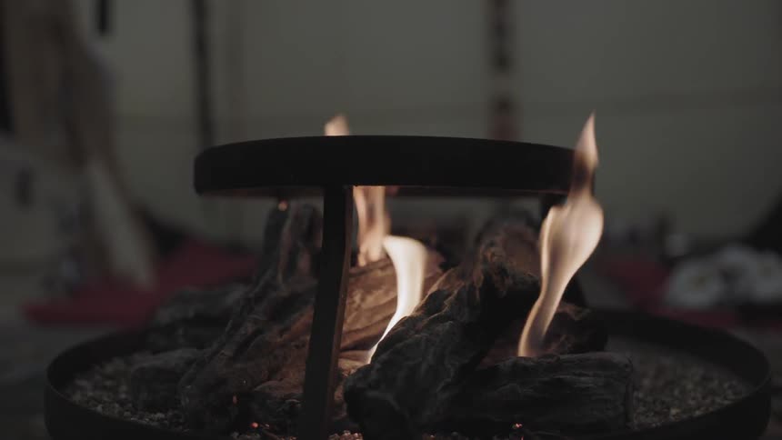 A small campfire is outside