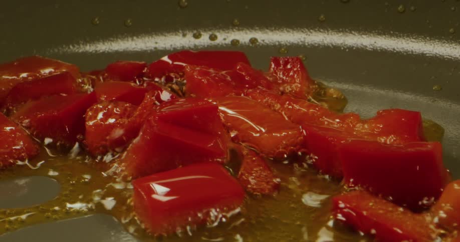 Cut up peppers and oil are in the pan