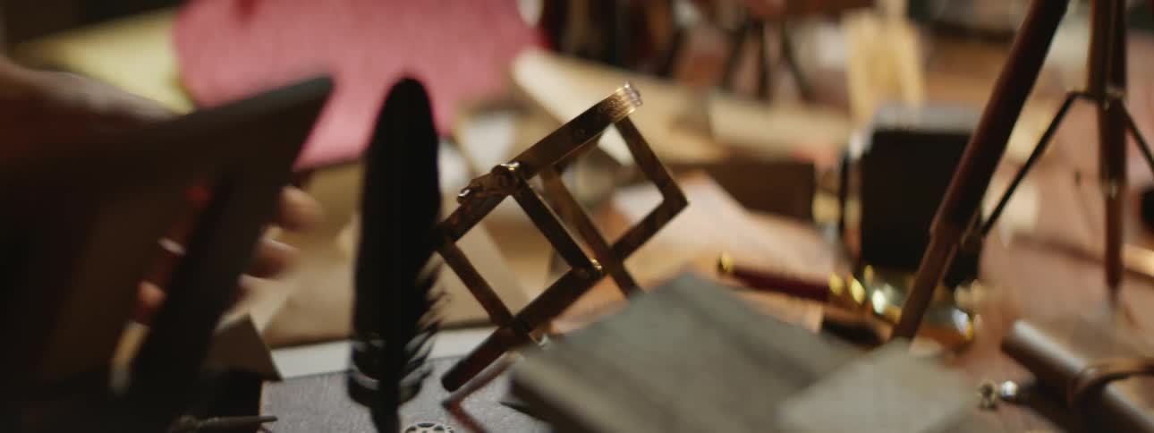 A person is placing tools on a desk