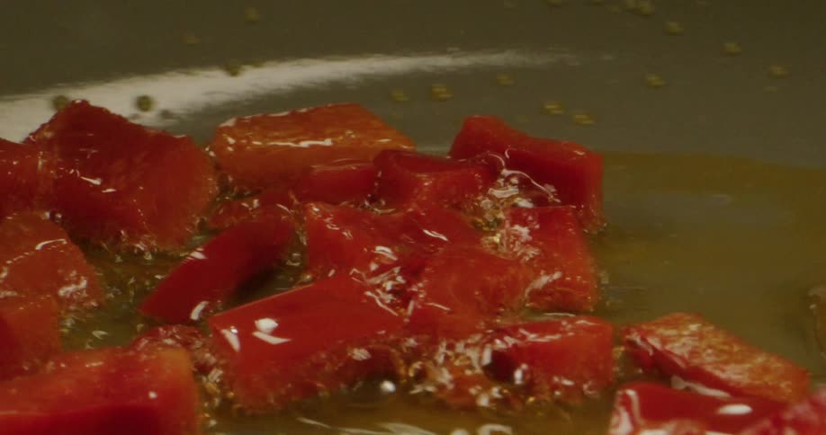 Food slides back and forth in a hot skillet
