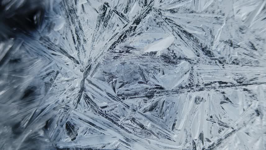 Time lapse close up of of sharp thin frosting ice crystals forming