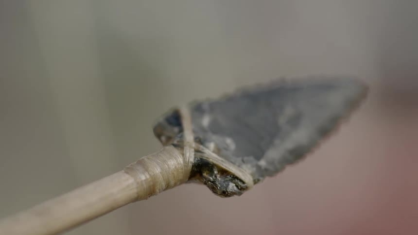 Twine holding an arrowhead on a shaft