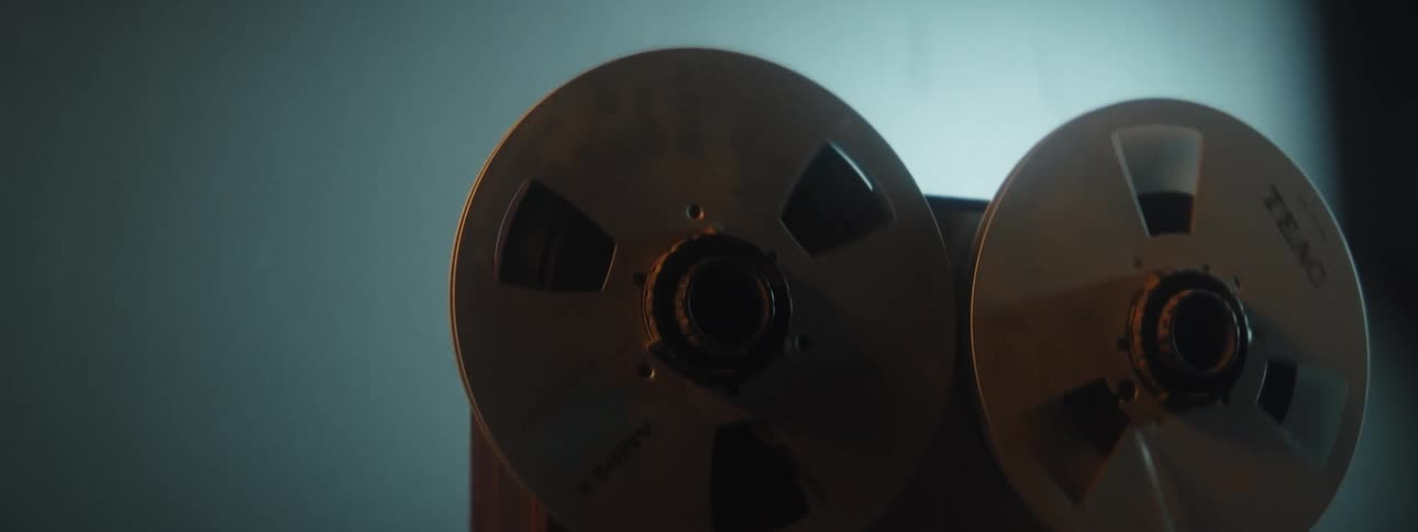 The reels turn on an old movie projector