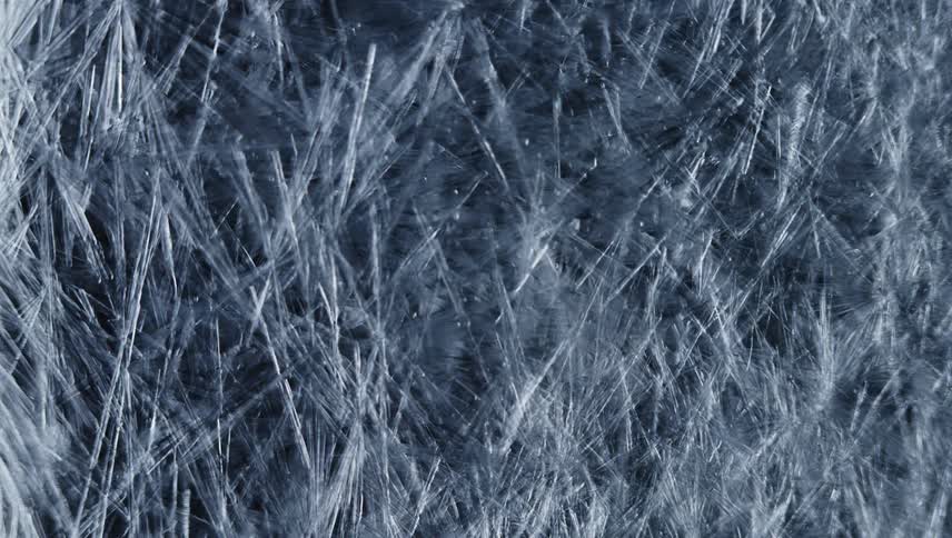 White lines grow and spread like cracks across the darkness as the darkness is covered