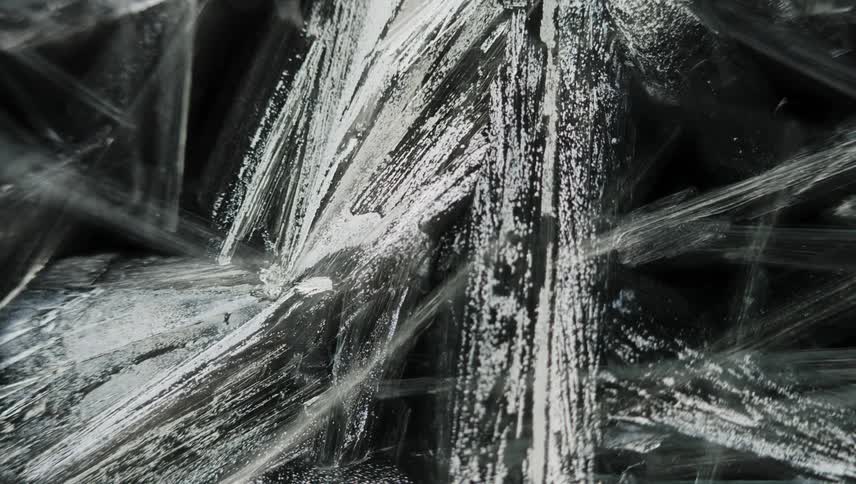 Time lapse close up of of sharp thin frosting ice crystals forming