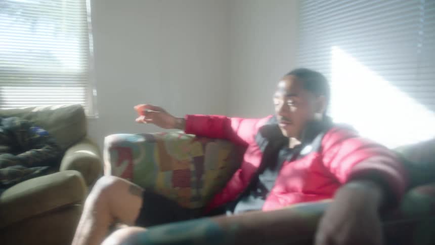 Group of friends relaxing on couchs in a room at home