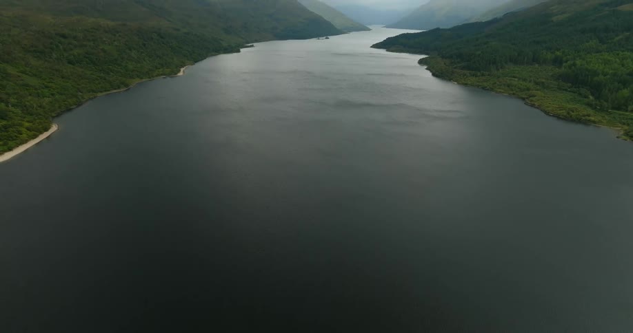 A large body of water is shown slowly from looking down to looking forward with greenery on all sides