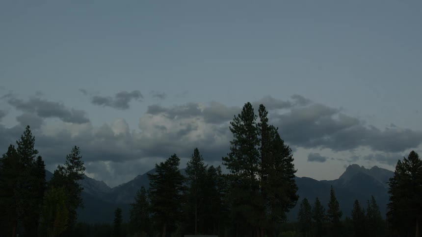 Clouds pass over the countryside as day turns to night