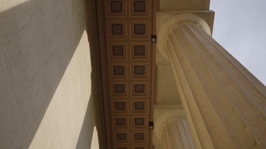 Decorative tiles on the outside of a building as seen from below