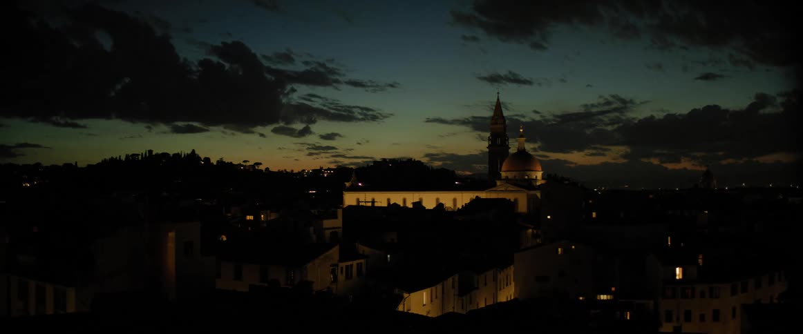 The sun is going down over a village