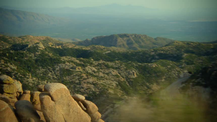 The road runs through the mountain range