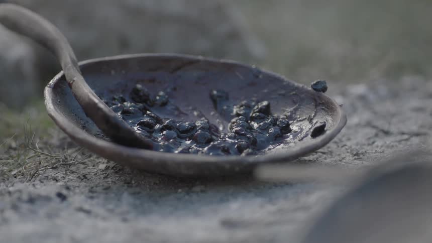 Black substance partly melted in pottery