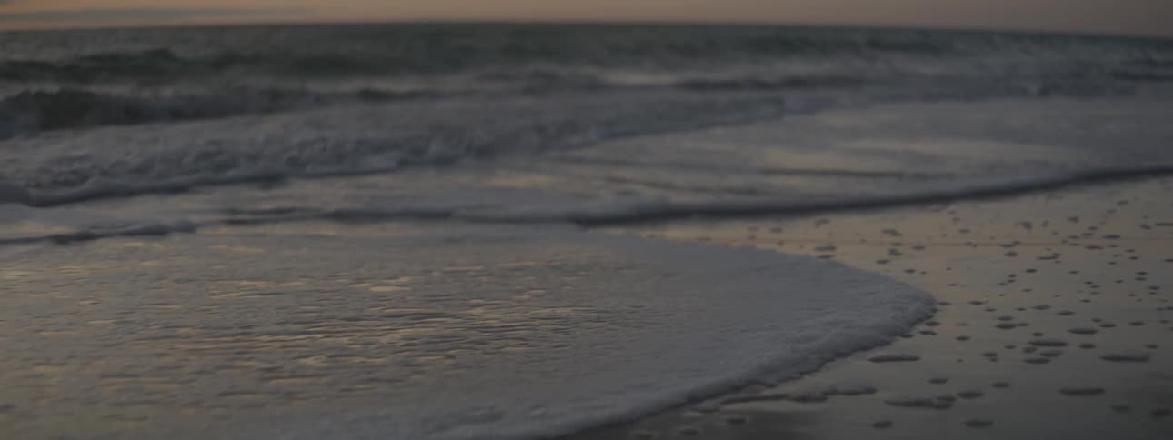 The waves crash on the shore