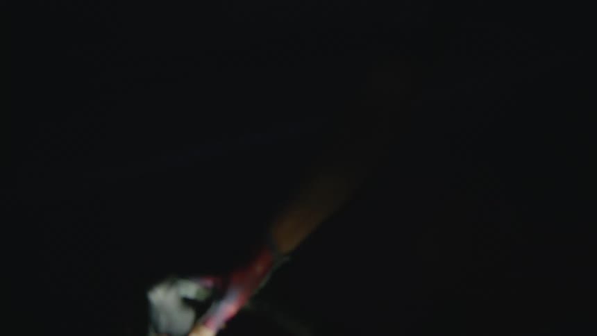 A person is riding their bike at night