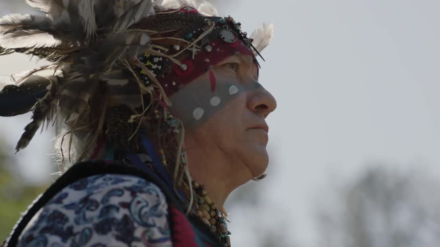 Tribal person with headdress and makeup