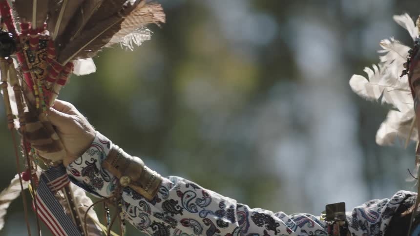 Tribal person decorated with  a lot of feathers
