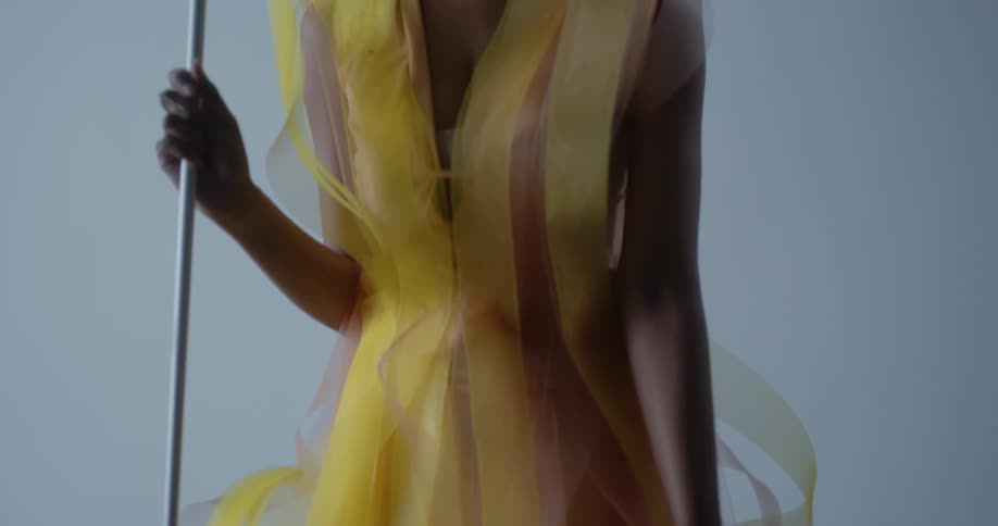 A woman in costume stands and smiles