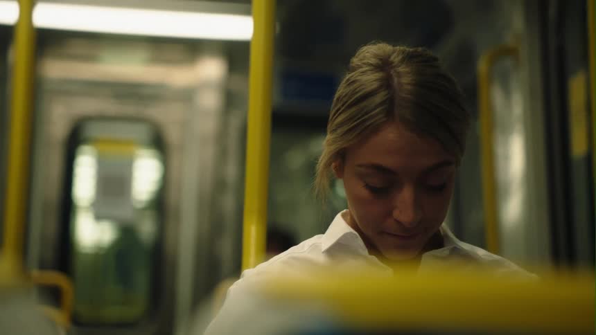A woman is riding on the train