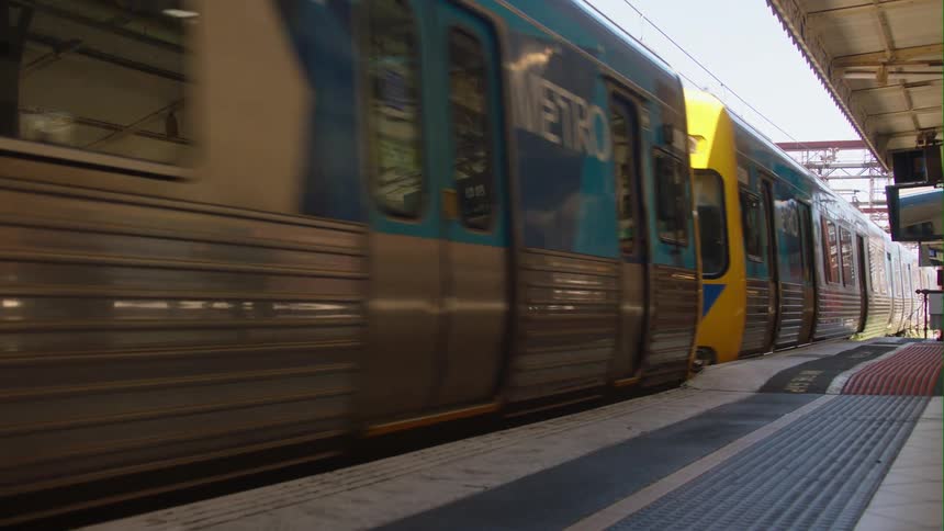A passenger train pulls into the subway station