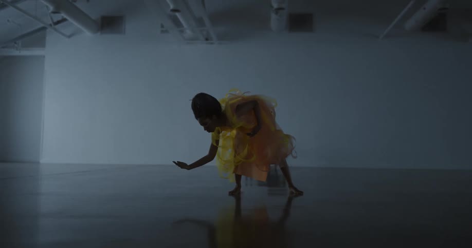 A woman is dancing in the hall