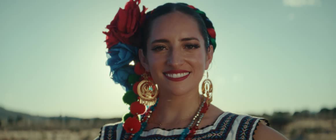 A portrait of a woman standing outdoors