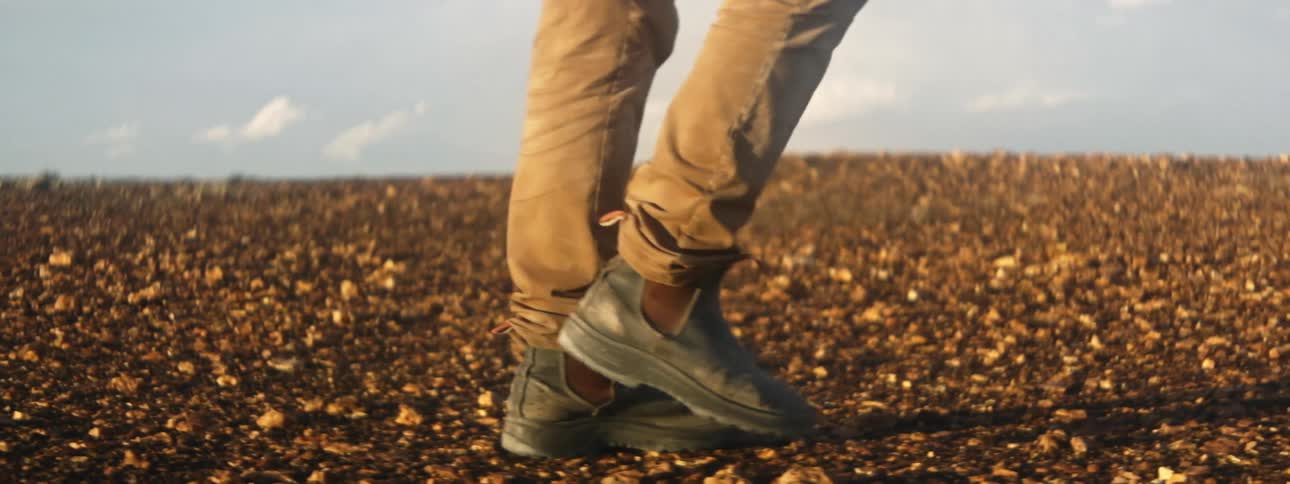 A person is walking on the rocks