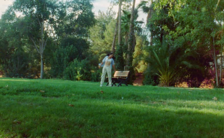 A woman is dancing in the park