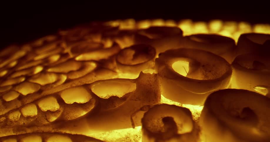 Abstract footage of lights shining on art