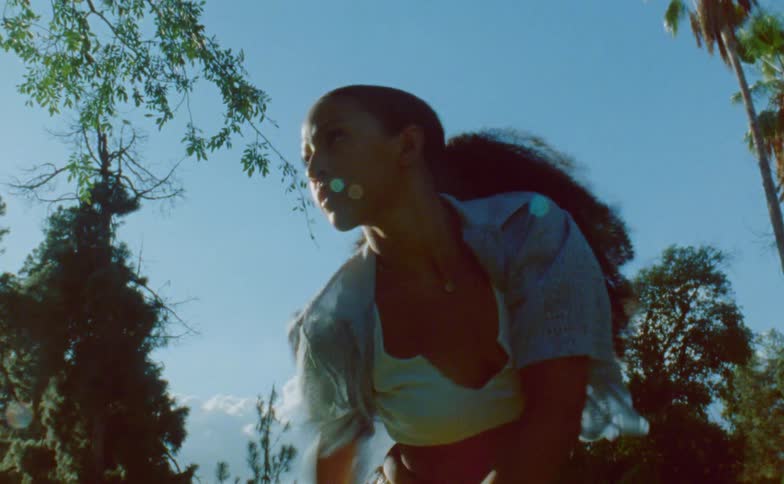 A woman dancing outdoors