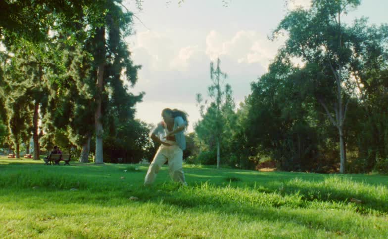 A woman dances in a public park