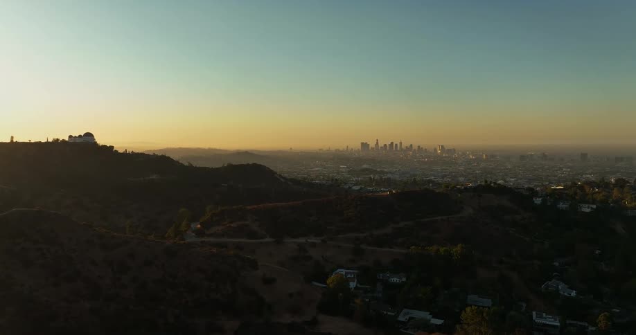 The sun is rising on the mountains
