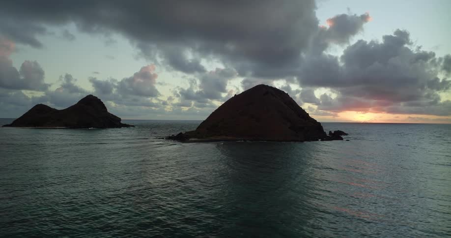 The sun is rising on the small islands