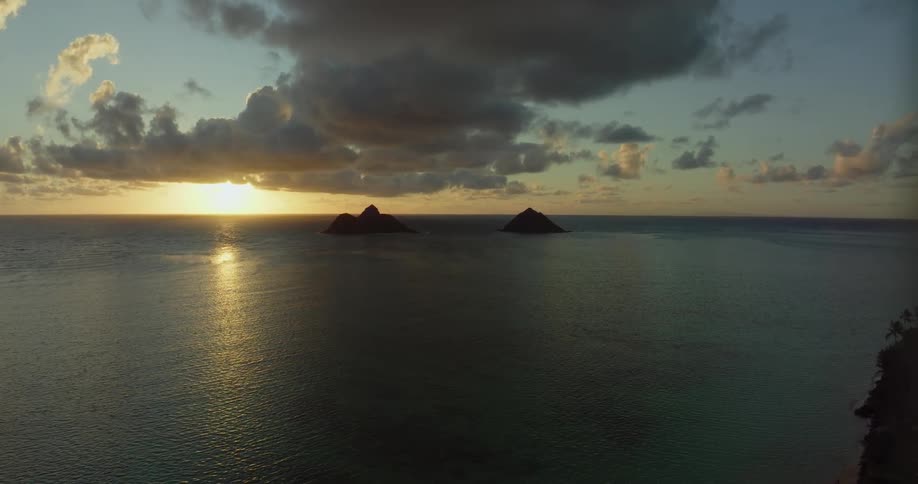 Small islands jut out of the ocean near the coast