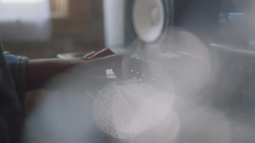 A man records himself playing the keyboard