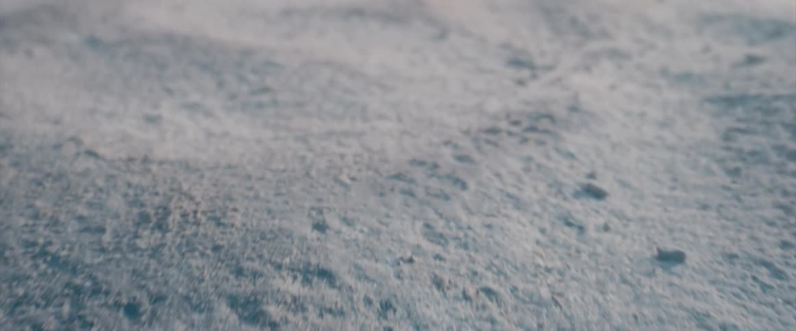 Close up of wind blowing across sand