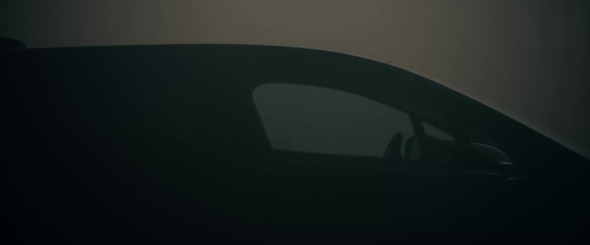 A car with illuminated tail and headlights