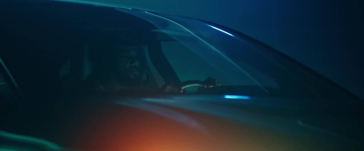 A man drives his vehicle through a tunnel at a high rate of speed
