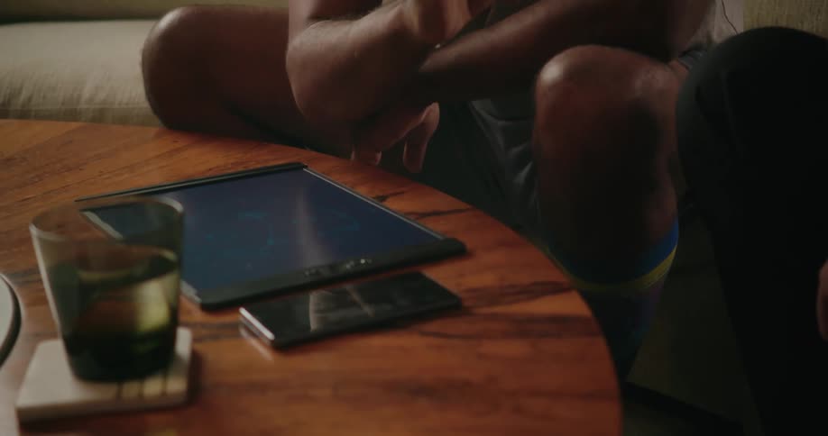 A group of people sitting around using a tablet