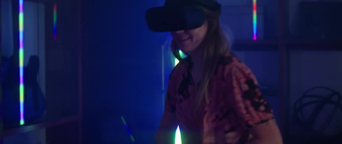 Two people playing tennis in virtual reality