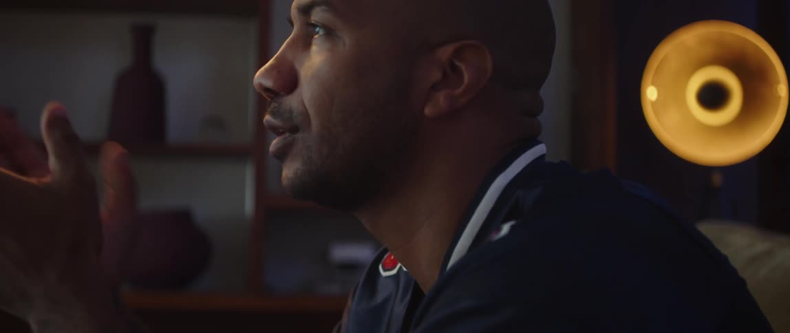 A man watching something on TV cannot believe what he is seeing