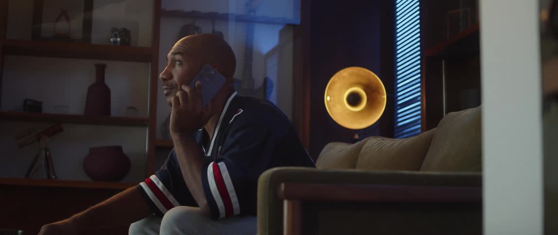 A man watching sports on tv