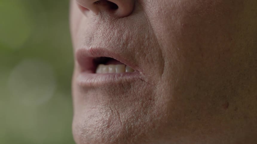 A man speaks outside