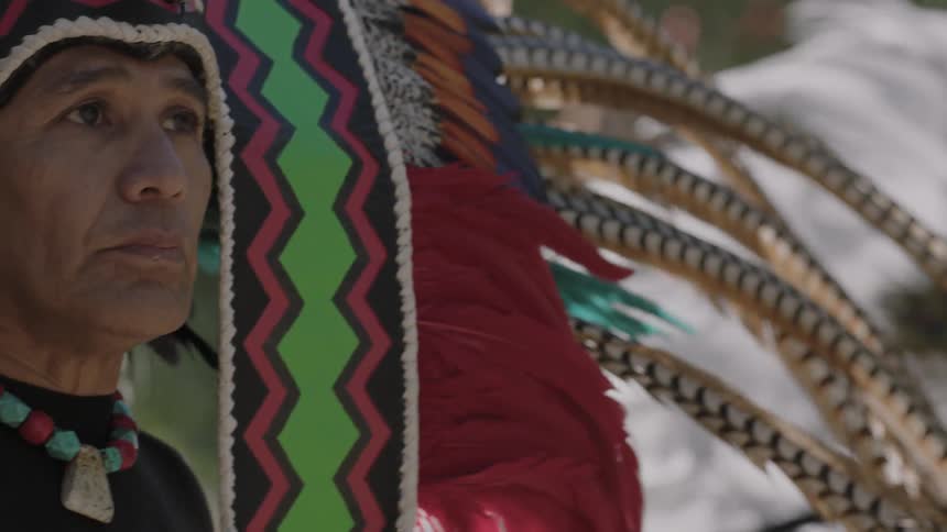 Tribal people wearing large headdresses