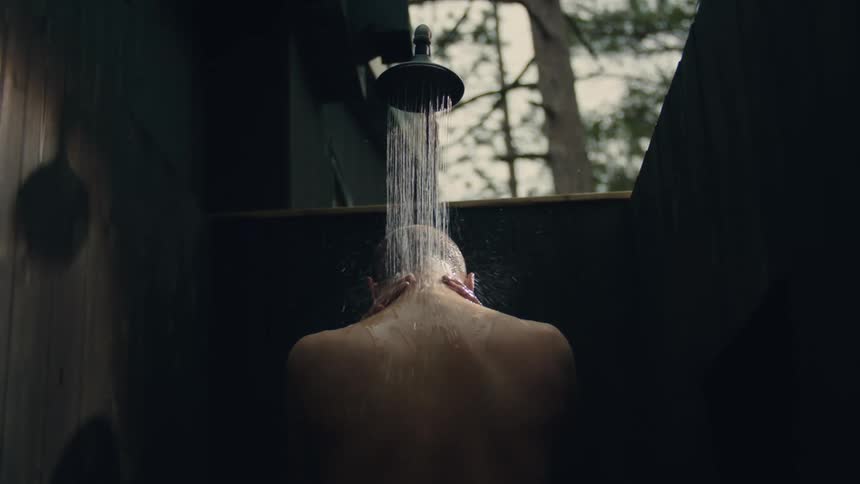 A person showers outdoors