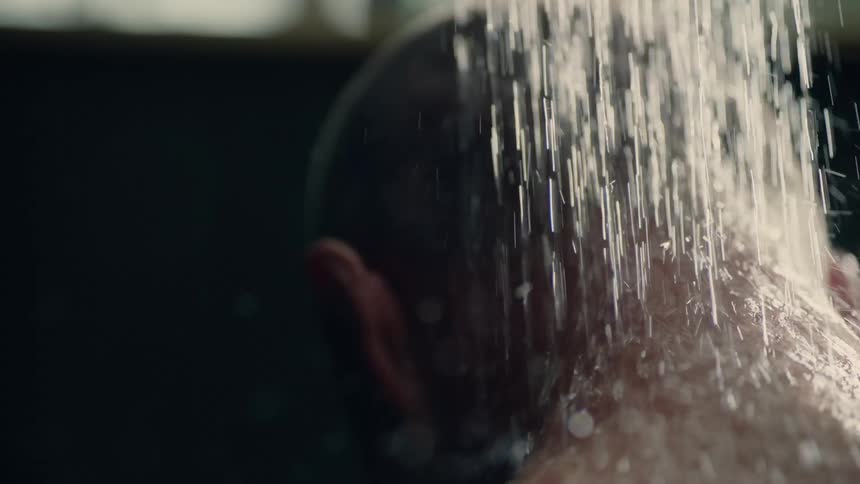 A man is showering outdoors