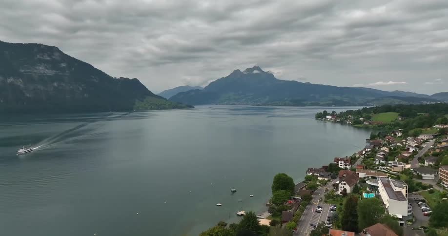 Aerial view of a small coastal european town on the mountains close to a lake