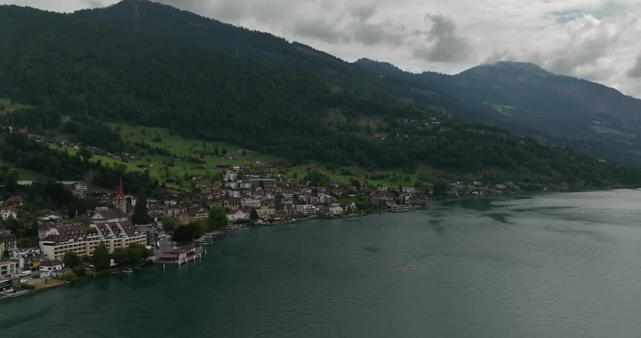 Aerial view of a small coastal european town on the mountains close to the ocean